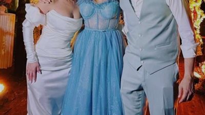 بسنت شوقي تتألق بفستان ستان بسيط وتسريحة الشعر البسيطة في حفل زفافها