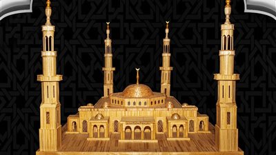 بـ 11 ألف عصا خشبية و6 أشهر..محمد حسين يبهر الجميع ويصنع مجسما لمسجد الفتاح العليم