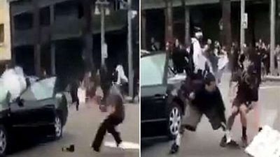 أمريكي يحاول تفريق المتظاهرين بالألعاب النارية فتنفجر سيارته وهو بداخلها