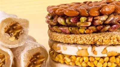 الإفتاء توضح حكم شراء حلوى المولد النبوي والتهادي بها