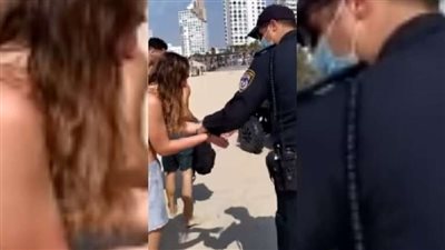 لهذا السبب.. تكبيل شابة على أحد شواطئ تل أبيب 