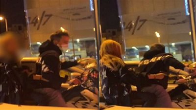 فتاة تحمل سلاح اثناء تجولها مع شاب على دراجة نارية