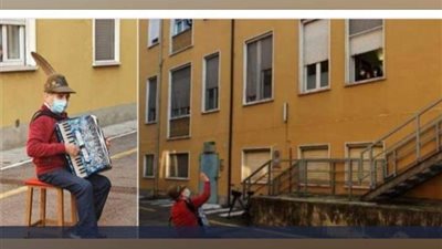 مسن يعزف لزوجته المريضة بكورونا تحت المستشفى