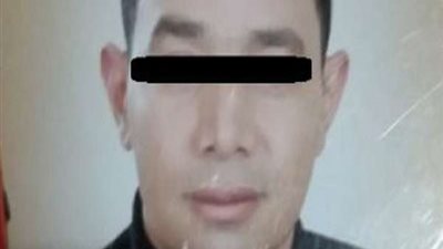 المتهم بقتل زوجته وصديقه ببولاق يجرى معاينة تصويرية لجريمته