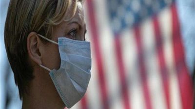 واشنطن تلزم السكان بوضع الكمامات في الأماكن المغلقة