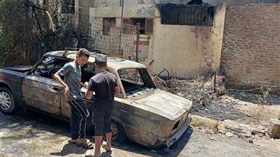 حريق مفاجئ يلتهم سيارة ويمتد لأسطح العمارات.. قصة كارثة بالأقصر (صور)